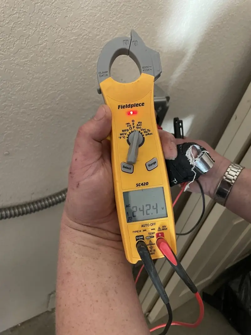Voltage testing with clamp meter during Whole House Surge Protector in Apple Valley